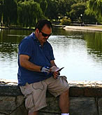 man reading "monumental words" gospel flyer